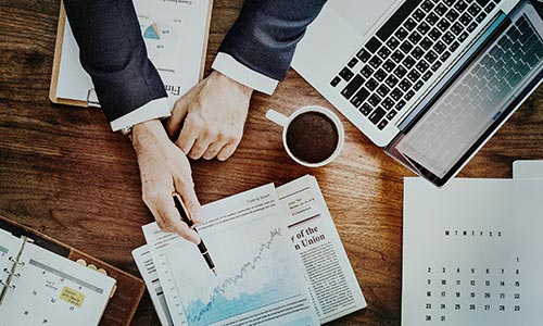 GESE Annual Reports - Laptop and Papers