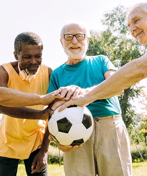 GESE Retired Members - Guys holding soccer ball